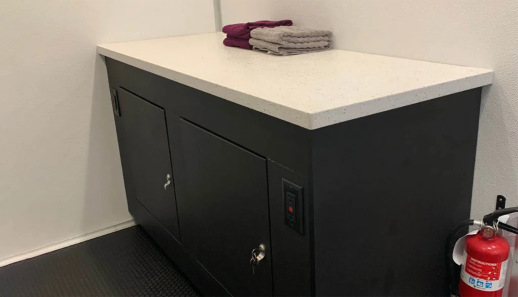 Folding station table inside of an 8-station laundry trailer