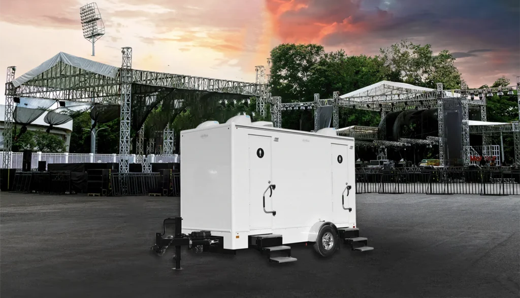 Restroom trailer in the parking lot at an outdoor music festival